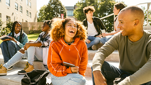 College students conversing on a staircase
